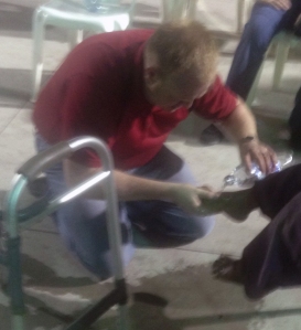 Jason Maxwell washing mans feet in Guatemala 1